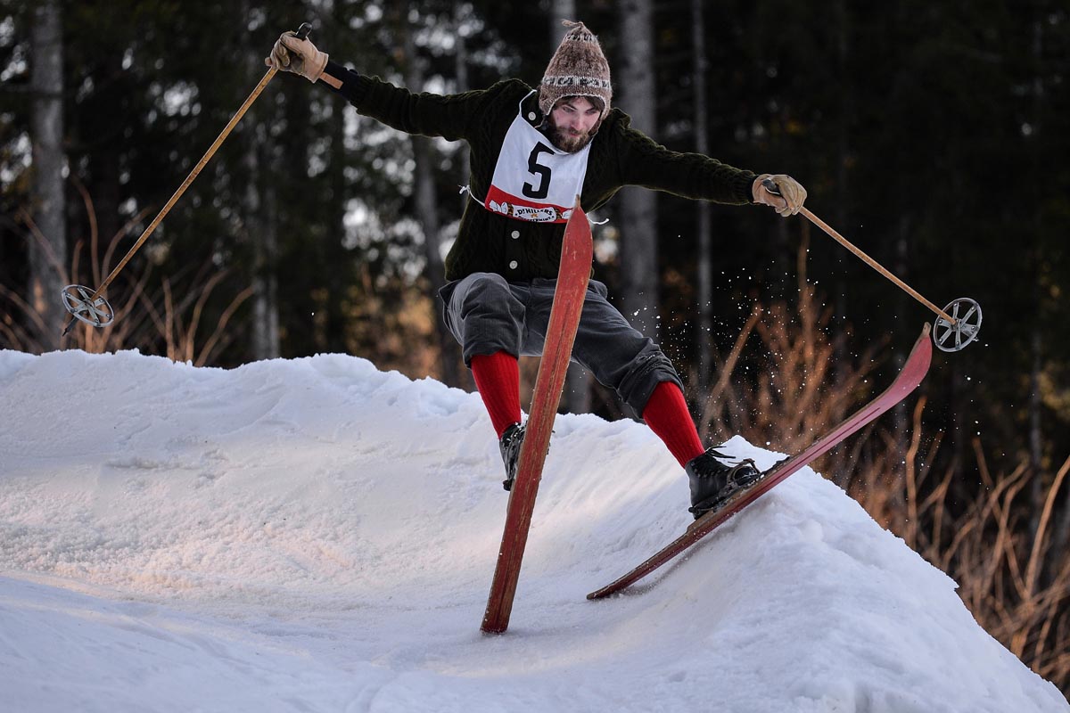 A participant on wooden skis and in vintage clothing speeds down the slope during the 'Nostalski' nostalgia ski race in Kruen, Germany, 13 January 2018. During the fun-oriented event, racers face a parcours with special tasks such as clearing various obstacles and drinking schnaps mid-race.
