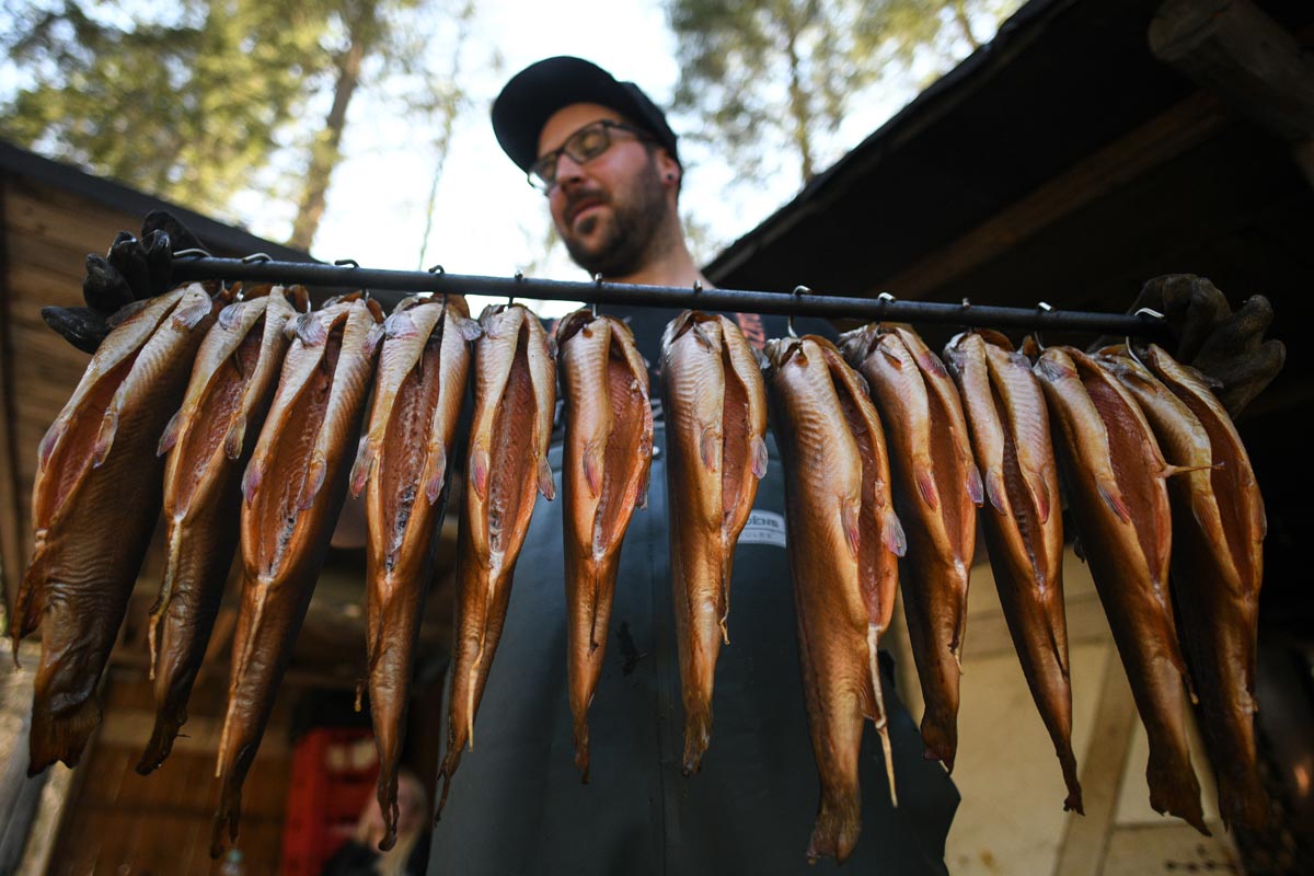 Master of fisheries Dominik Blees inspects smoked trout at his small fish farm ‚Platzfisch‘ in Klais, Germany, 07 April 2020. Due to the ongoing pandemic of the COVID-19 disease caused by the SARS-CoV-2 coronavirus, Blees is faced with less orders from hotels and restaurants and resorts to delivering to local end customers as well as selling directly in his small shop.